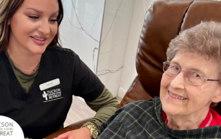 One of our caregivers provides quality care to one of our residents, representing how services like respite care can help loved ones.