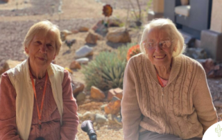 2 seniors at our facility enjoy themselves, representing how seniors can do well despite challenges like vision loss.